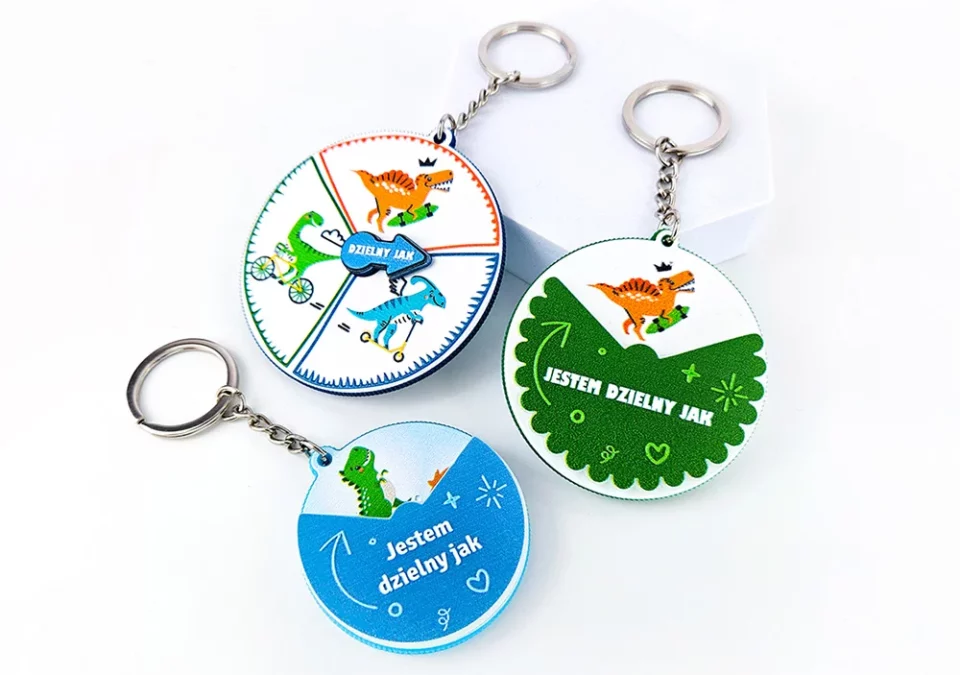 Rotating keychains, with movable elements, made of hard resin, manufacturer DECARD