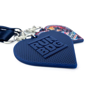 The back of the medal with raised 3D lettering and embossed patterns all over, Polish manufacturer DECARD