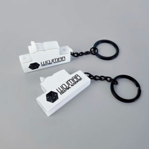 3D keychains made of hard resin, black and white, shaped like a circuit breaker, Polish manufacturer DECARD