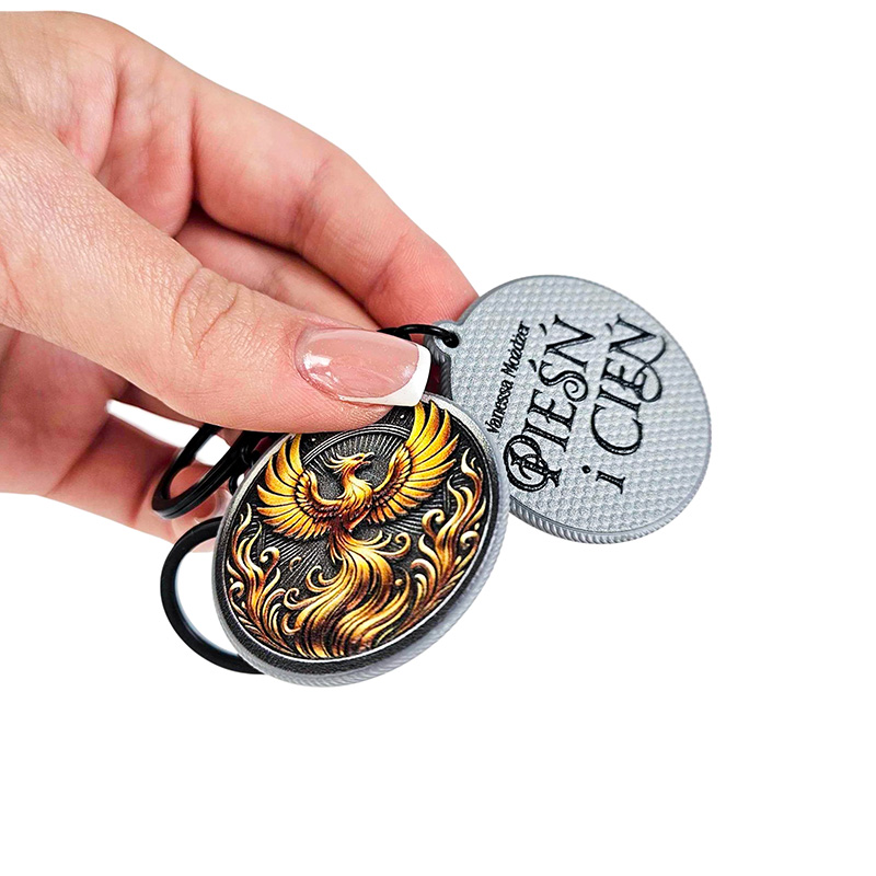 Keychains made of hard glossy resin, 3D texture, book promotion Song and Shadow, Polish manufacturer DECARD