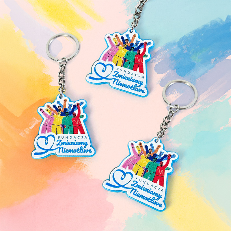 Colorful keychains for the Zmieniamy Niemożliwe Foundation, made of hard and lightweight resin, Polish manufacturer DECARD