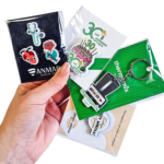 Keychains, pins, and magnets with custom card holders, made by Polish manufacturer DECARD