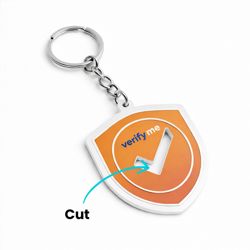 Metal keychain with a cutout, shield-shaped, sports style, made by the Polish manufacturer DECARD