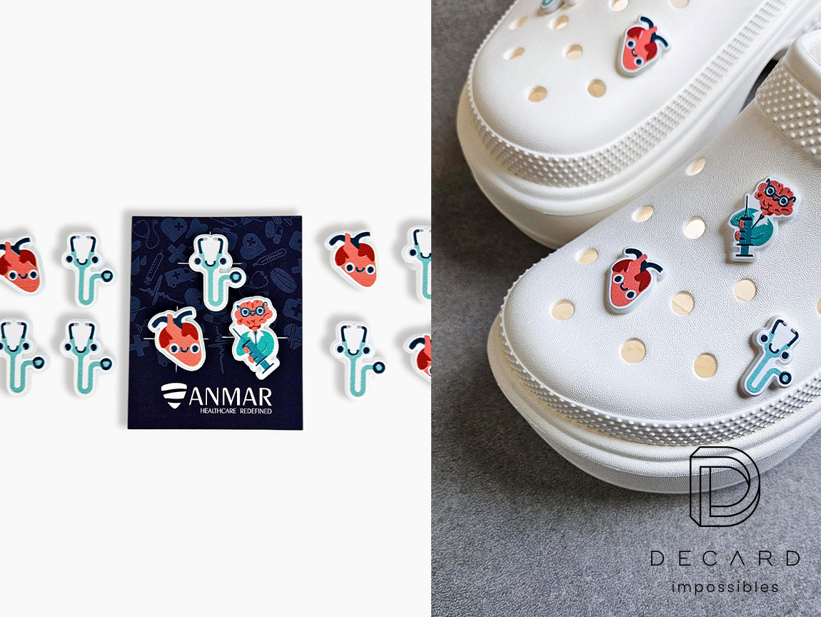 Crocs pins on white shoes and on a dedicated backing card, medical hearts and stethoscope design, made by Polish manufacturer DECARD