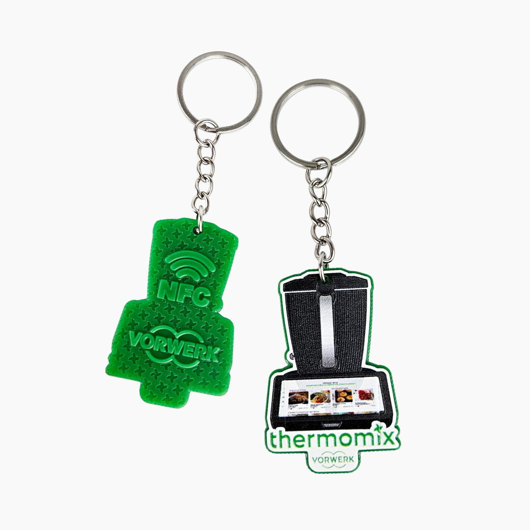 NFC keychains with a Thermomix graphic on the front and 3D branding on the back, manufactured by Decard