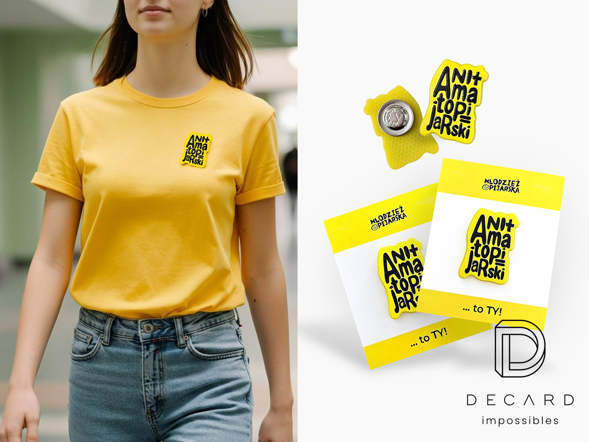 Personalized pins on a backing card and on a sweatshirt, fastened with a magnet; made by Polish manufacturer DECARD