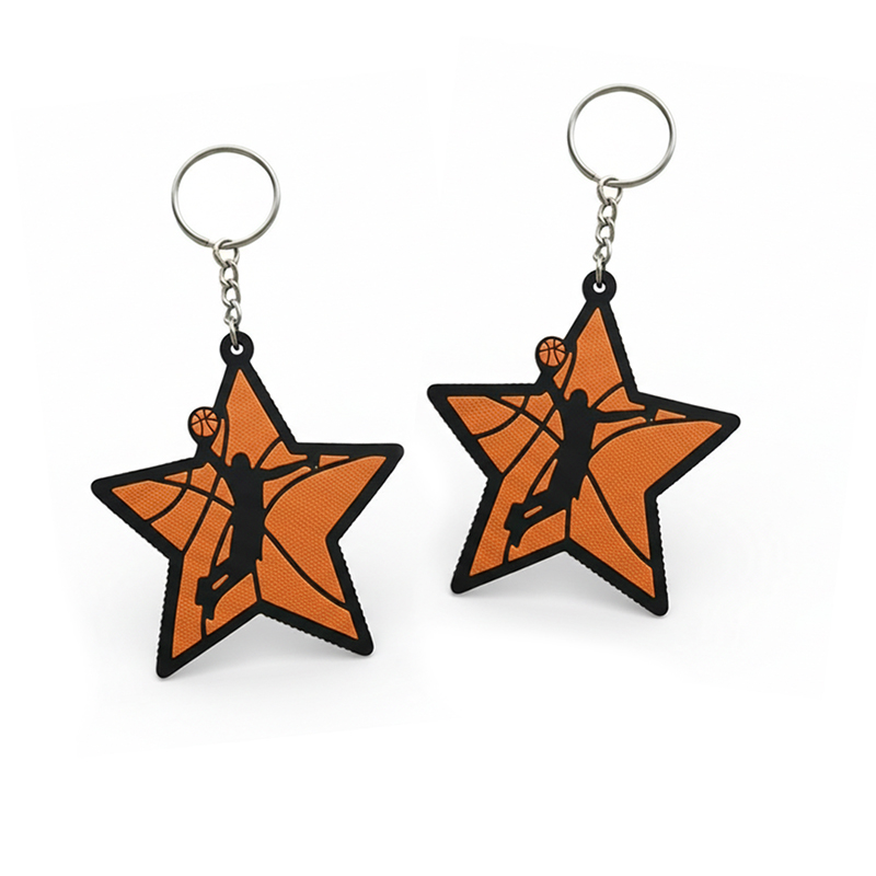 3D basketball keychain in the shape of a star with a mini basketball player inside, made of hard resin, with vivid colors and decorative 3D patterns on the edges. Made by the Polish manufacturer DECARD