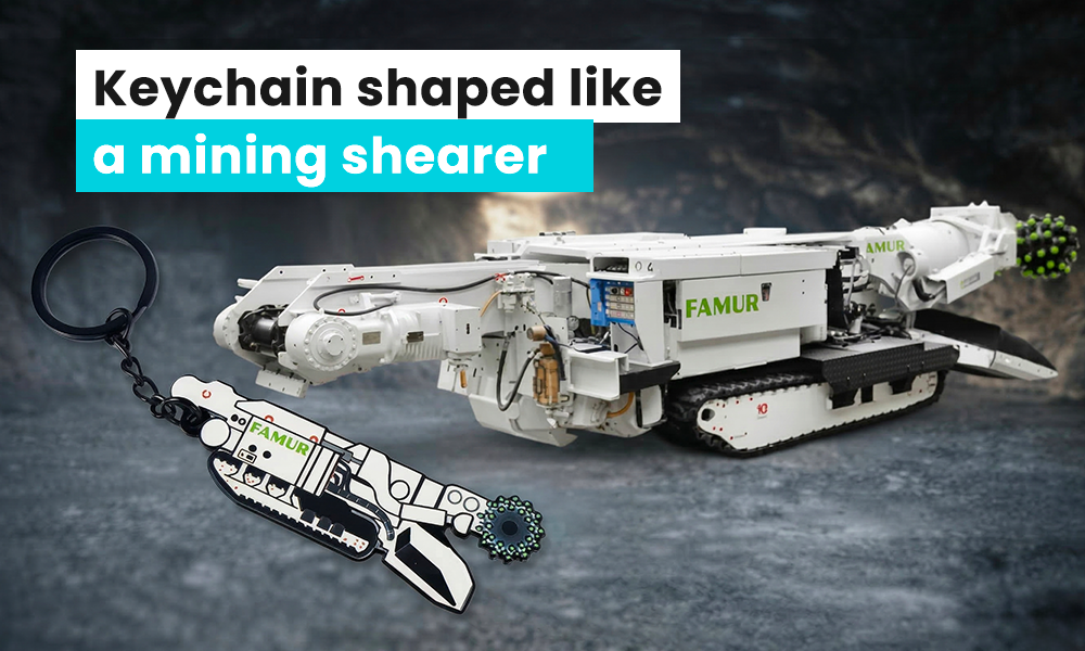 Keychain shaped like a mining harvester, made for the company FAMUR, produced by the Polish manufacturer DECARD