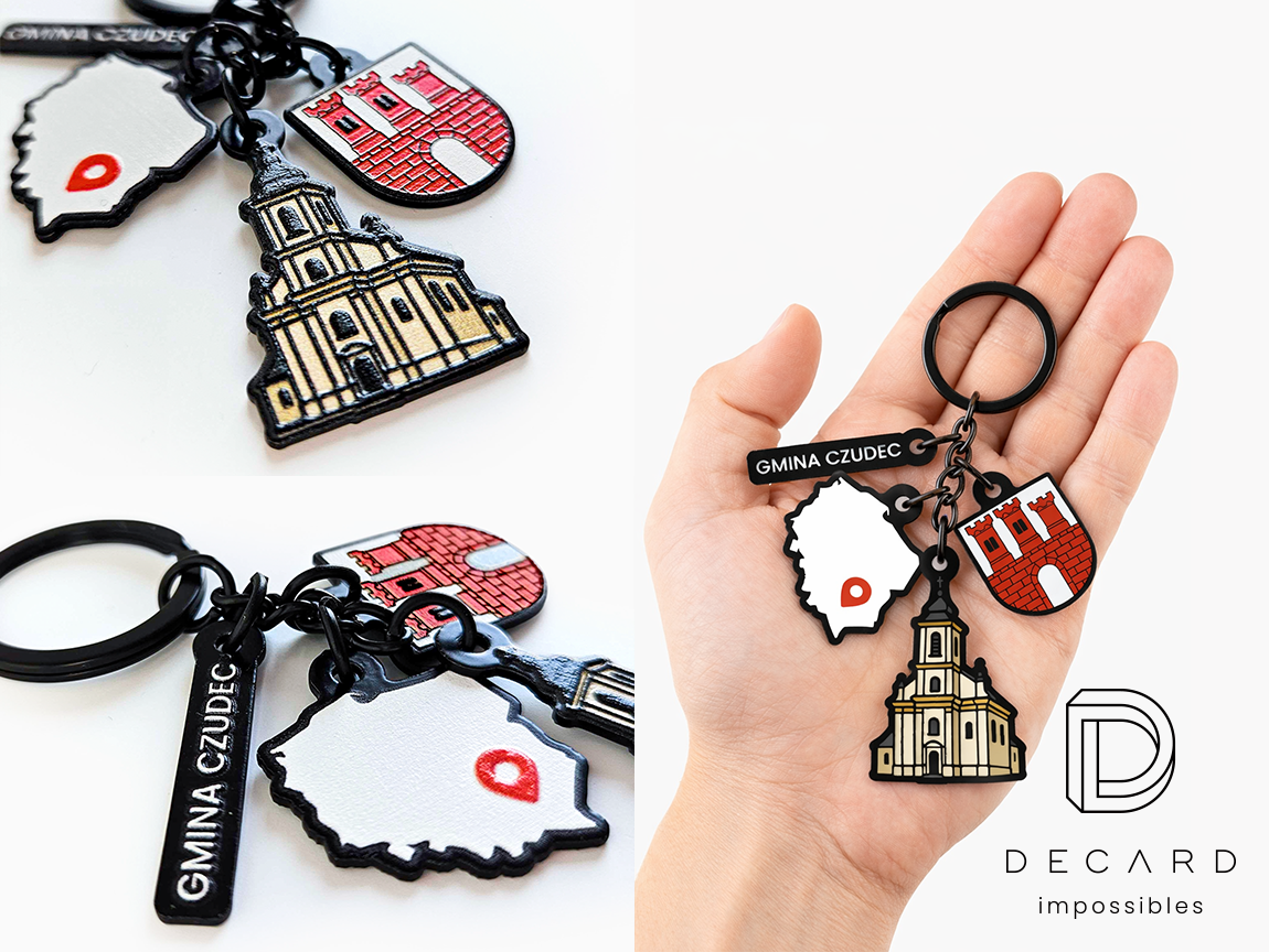 Keychains with 3 charms: a church, a map, the coat of arms of the Czudec municipality, and an inscription, made by the Polish manufacturer DECARD