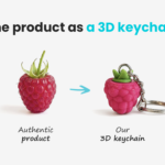 3D raspberry keychain with a leaf and the fruit’s distinctive texture, made by Polish manufacturer DECARD