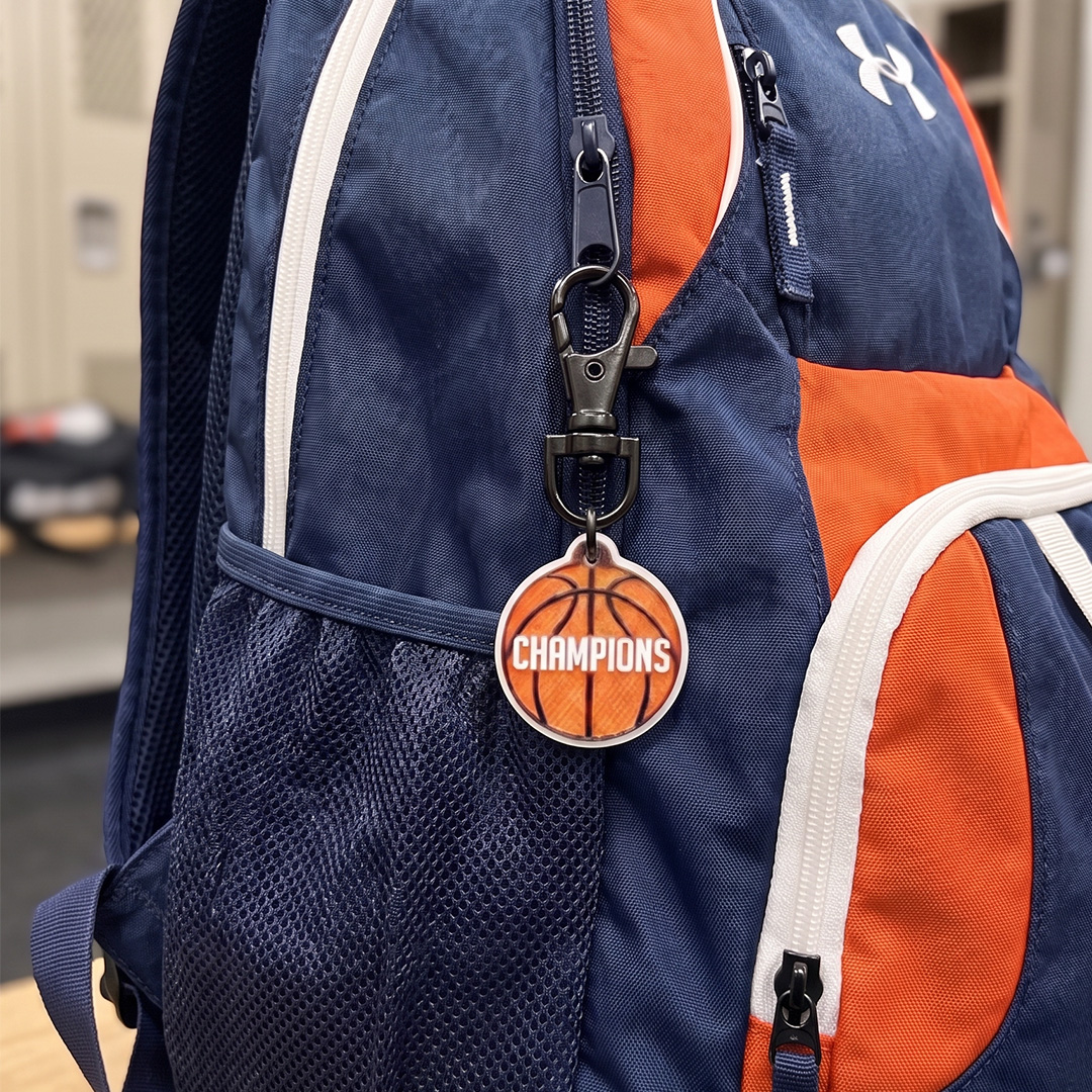 Basketball keychain with a carabiner attached to a sports backpack