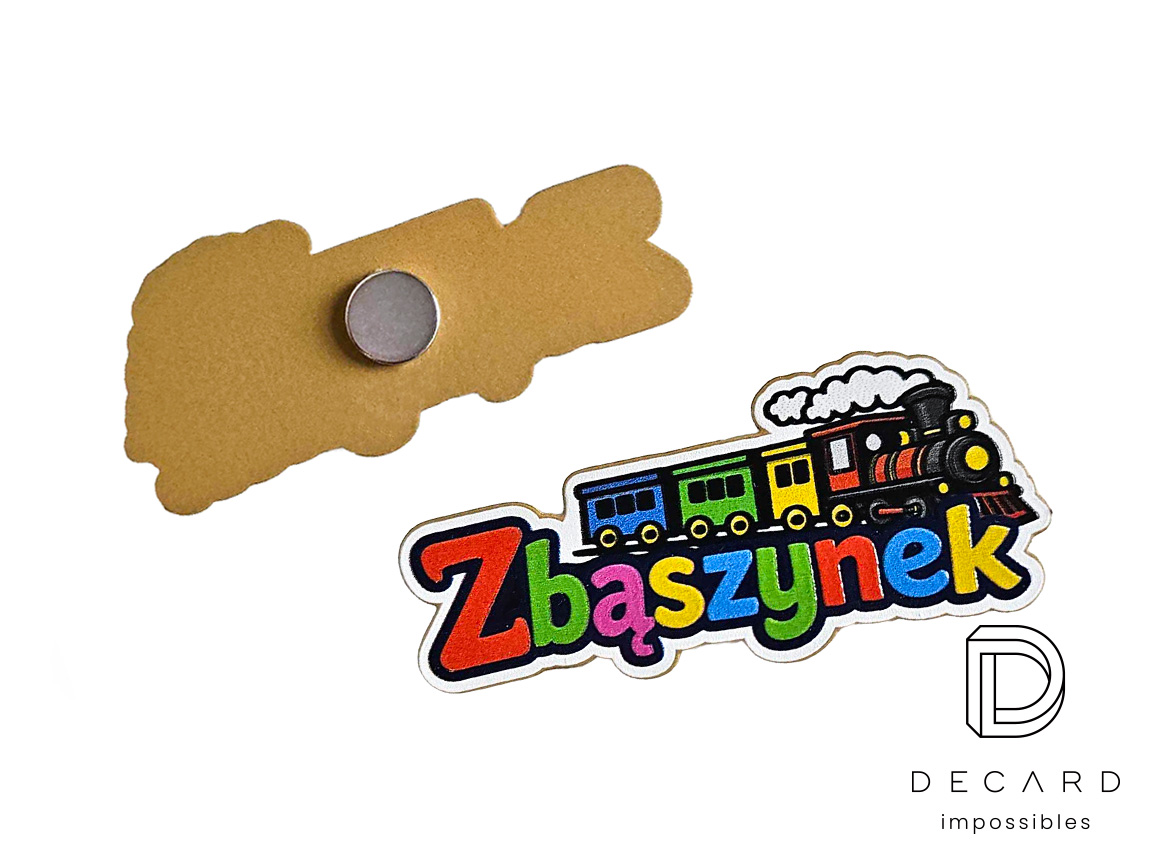 Metal train magnets with the text “Zbąszynek”, gold-painted back, colorful graphic on the front, made by Polish manufacturer DECARD